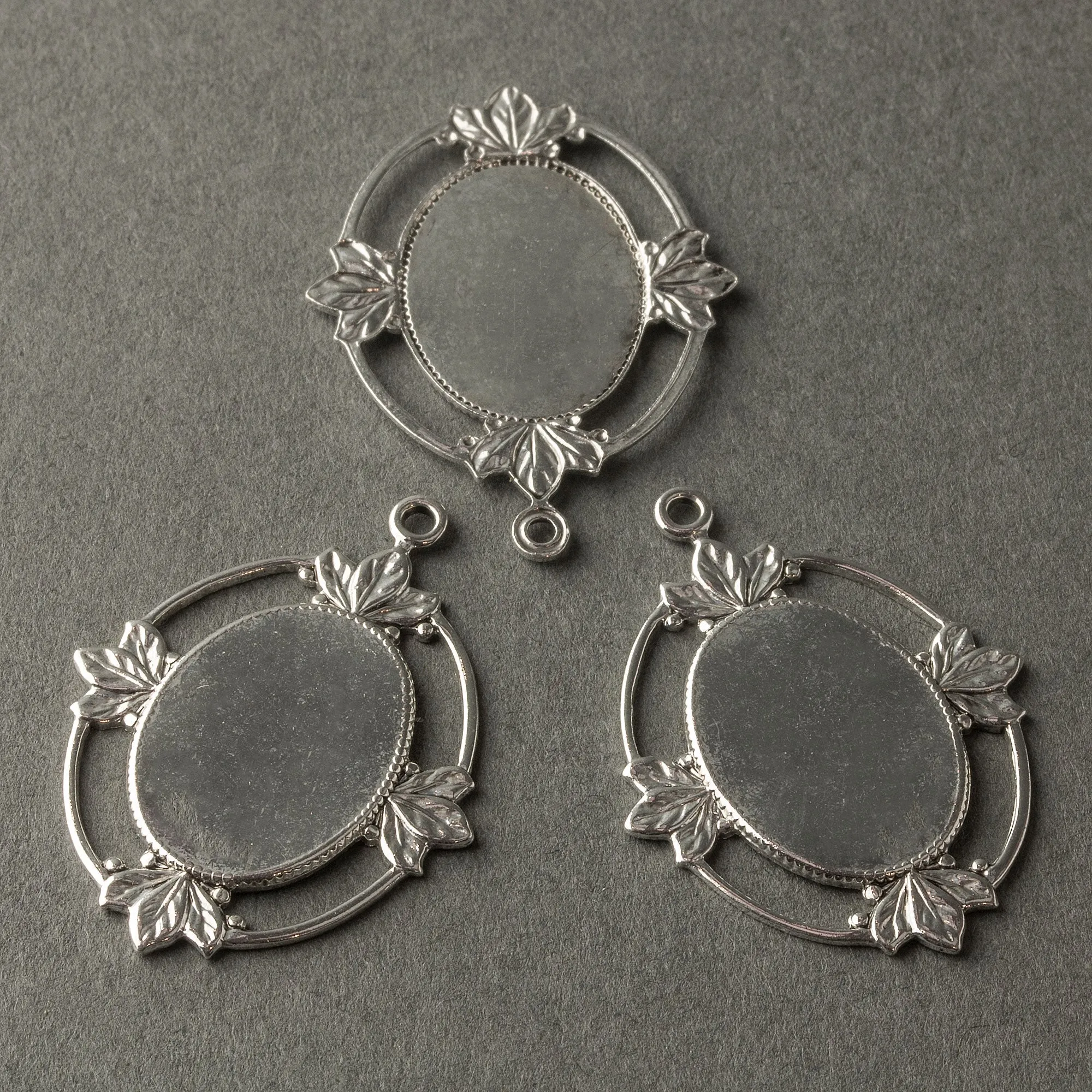 Sterling silver plated brass frame setting for 19x13mm cabochon. 1 ring. Pkg of 1 b9-0803-5s